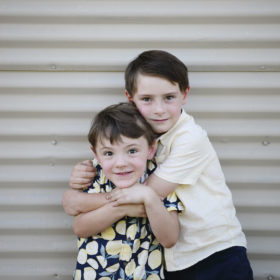 brothers hugging in east sacramento california summer