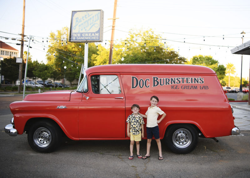 two young brothers in front of red ice cream van east sacramento california 