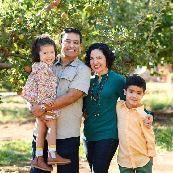 family in an apple orchard fall photo shoot