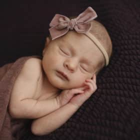 newborn baby girl sleeping studio photo shoot