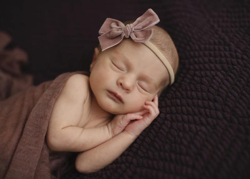 newborn baby girl sleeping studio photo shoot
