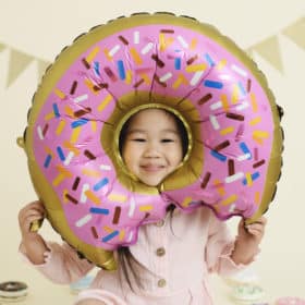 girl with pink donut balloon with sprinkles studio photography sacramento california