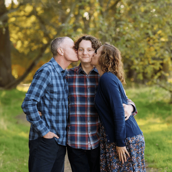 mom and dad with son fall photo shoot sacramento california