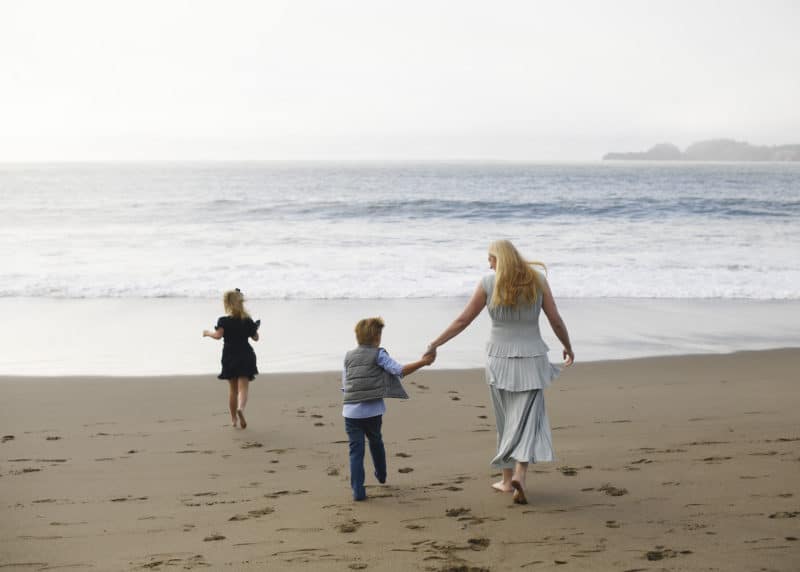 mom with son and daughter on the beach in san francisco bay