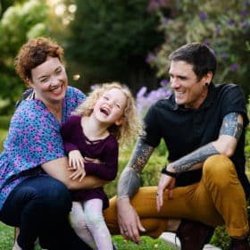 family laughing in the rose garden sacramento california