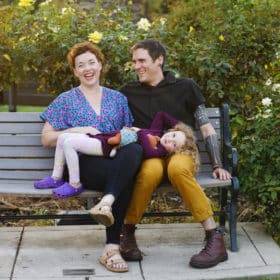 family photo shoot on a bench in the rose garden sacramento california