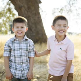 young brothers smiling under the oak tree gibson ranch california