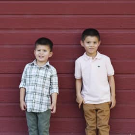boys posing in front of red accent wall gibson ranch california sacramento