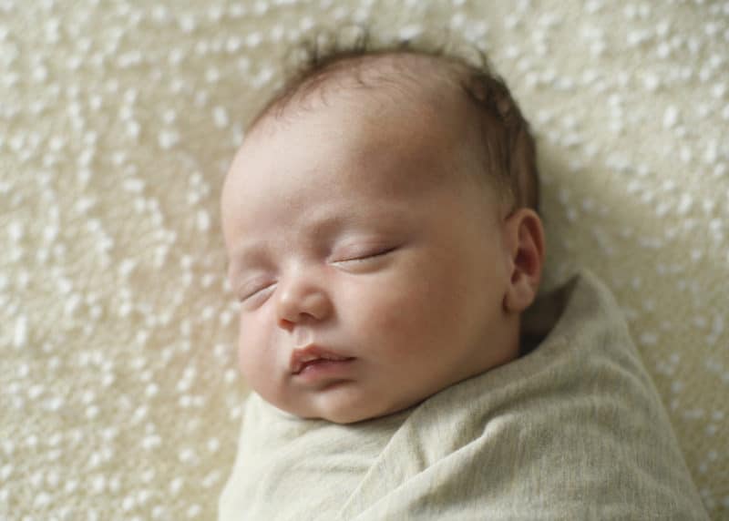 newborn baby boy sleeping peacefully newborn session sacramento california