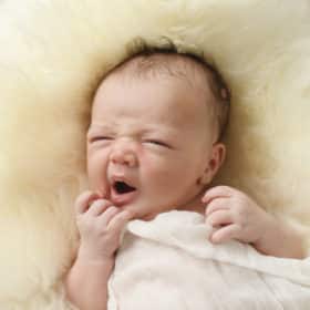 newborn baby boy yawning at-home newborn session sacramento california