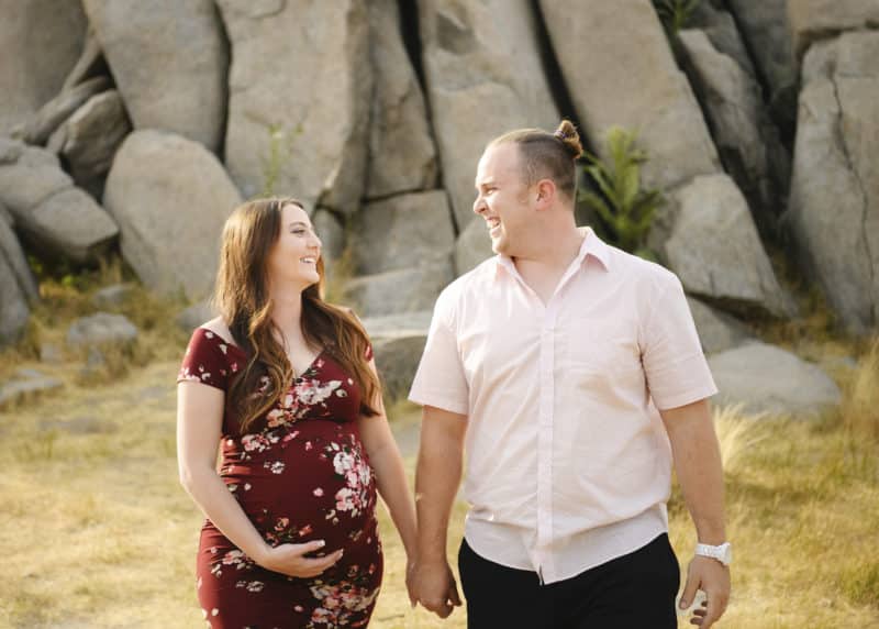 couple looking at one another pregnancy photo shoot granite bay california