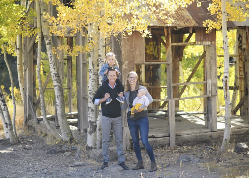 family of four fall photos among the aspen trees and cabin truckee california