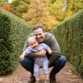 dad and young son laughing fall family photos