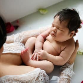 newborn baby boy with mom milk bath