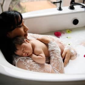 newborn baby session with milk bath at home