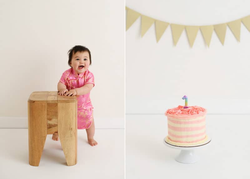 one year old baby girl smiling, smash cake with one candle