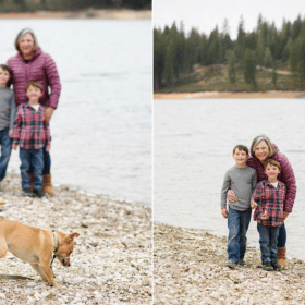 family of three posing by the lake on camping trip