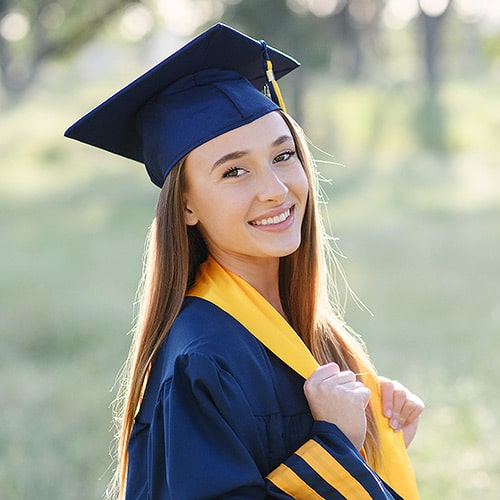 wearing a cap and gown for your senior portraits makes a great outfit idea