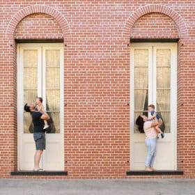 family of four in front of old brick building in old sacramento california