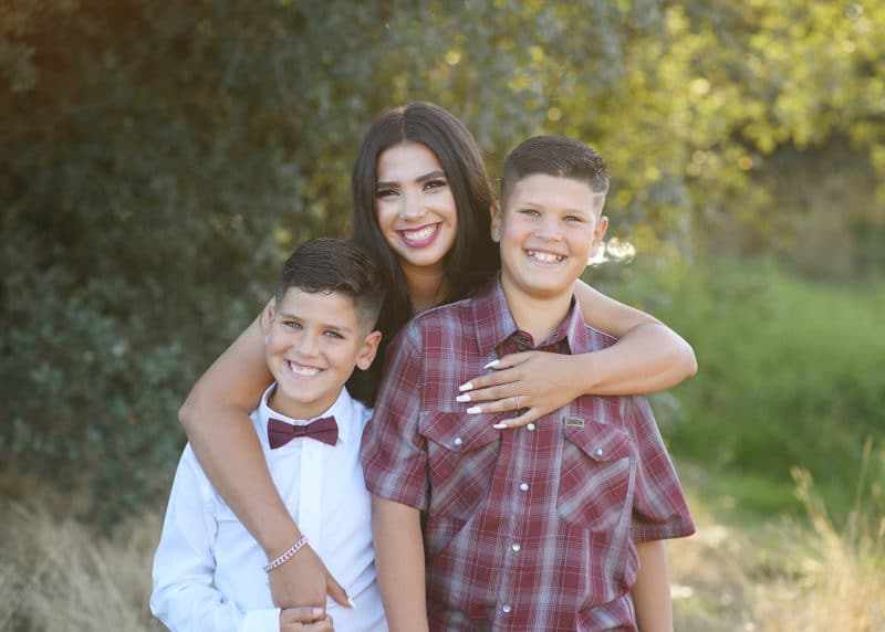 older sister with younger brothers outdoor photo shoot elk grove california