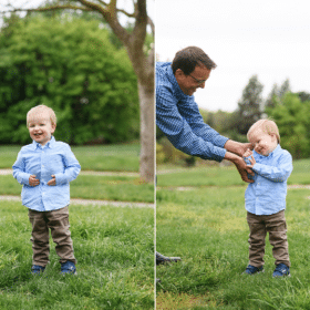 young boy with dad giggling in a green field sacramento california