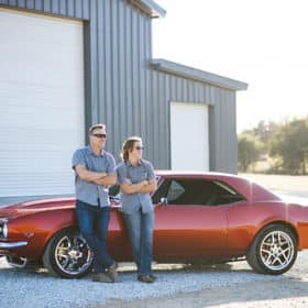 dad and son posing in front of classic car and garage rescue california