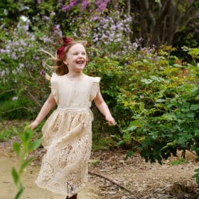 young girl running along a path in springtime sacramento california