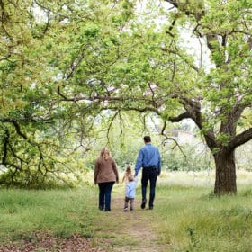 family of four walking along path in spring sacramento california