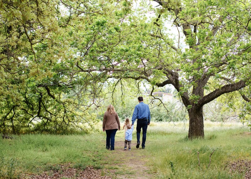 family of four walking along path in spring sacramento california
