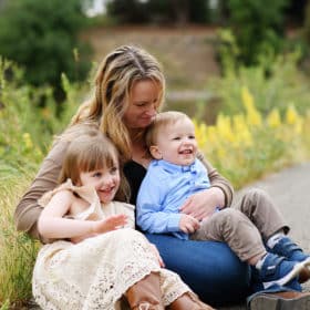 mom with son and daughter among wildflowers in sacramento california