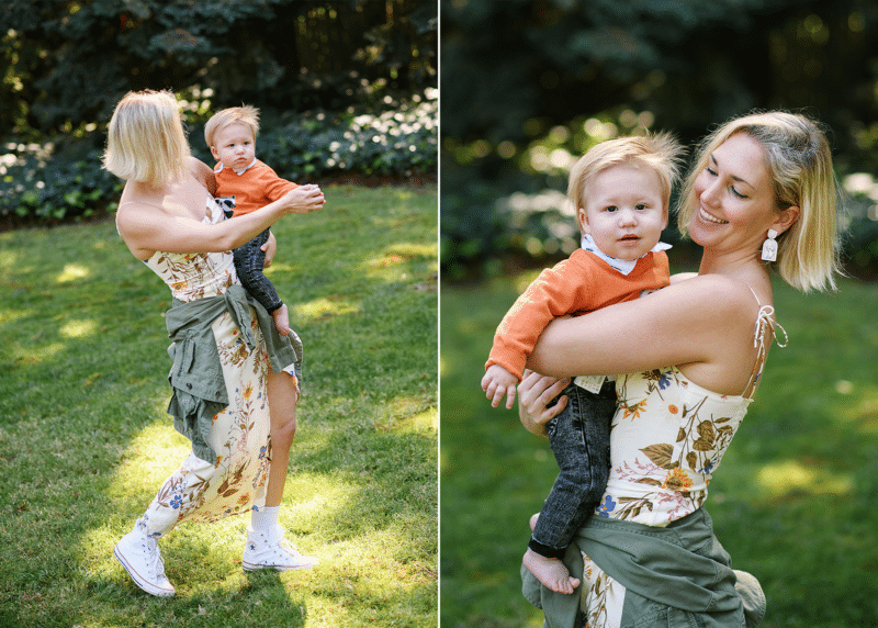 mom swinging and dancing with toddler boy, smiling at the camera