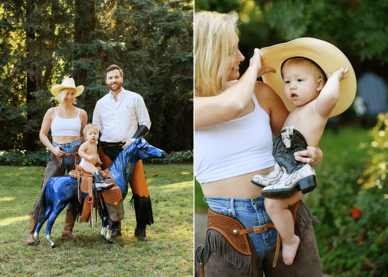 family dressed in cowboy gear with baby boy sitting on a metal horse, wearing a cowboy hat