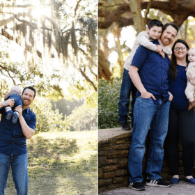 family of four posing along stone wall outdoors, dad carrying baby on his shoulder
