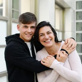 high school son and mom hugging during senior photo session