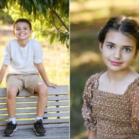 young girl looking at the camera, young boy sitting on a bench in the park