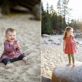 baby girl clapping while sitting on the sandy beach, big sister standing on a rock looking out at lake tahoe