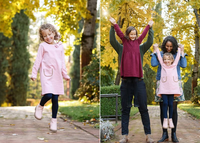 mom and dad lifting young daughters up by the arms, young girl dancing in the fall leaves
