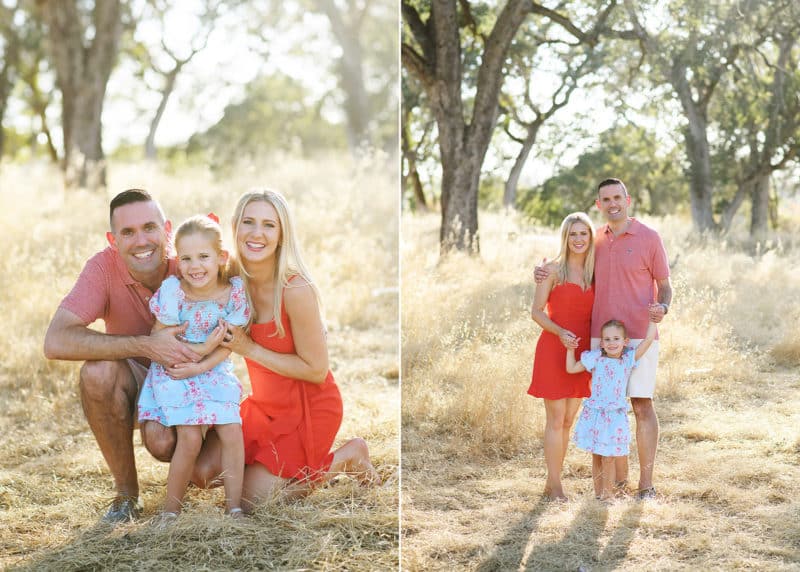 family of three posing together in a field with oak trees during summer in folsom california