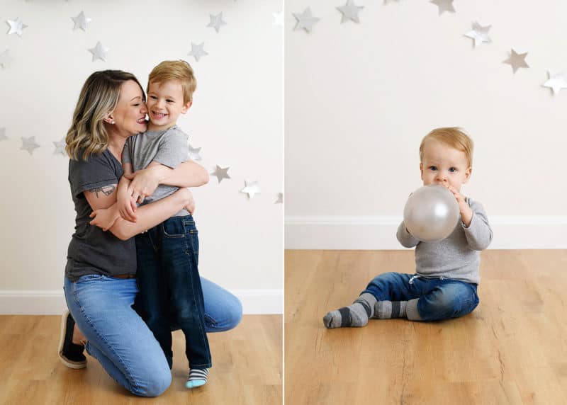 mom kissing young son on the cheek, baby boy blowing up a silver balloon