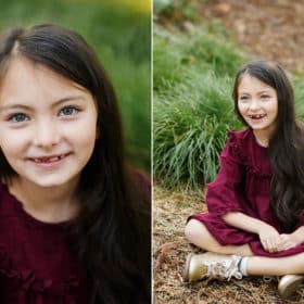 young girl sitting on the forest floor smiling during fall family photos in davis california