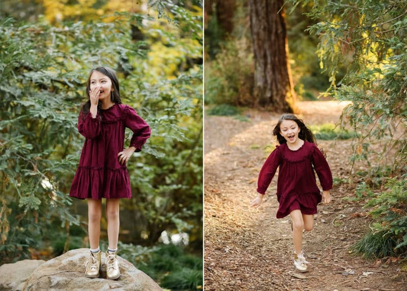 young girl standing on a rock in the forest, running through the trees in davis california