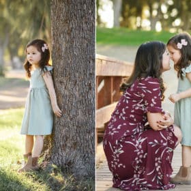 young girl standing by the tree, mom and daughter touching foreheads during family session in sacramento california