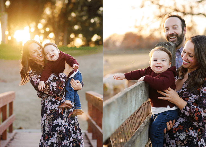 mom and dad holding young son by a fence with animals, mom and son laughing in the sunset