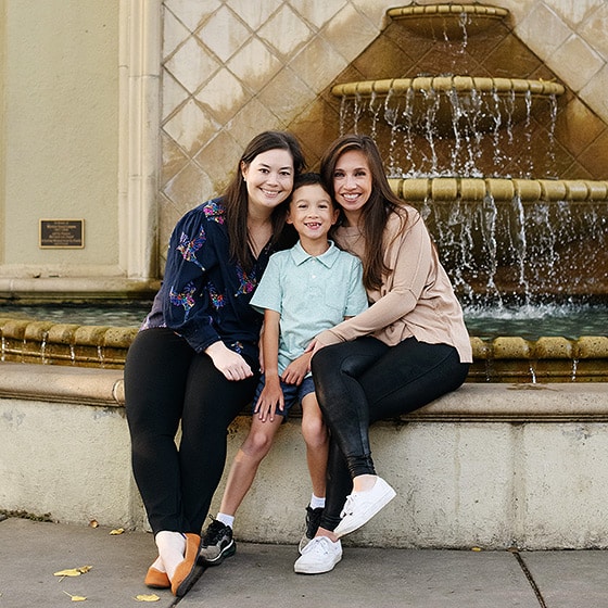 lgbtqia+ family posing in front of a fountain in berkeley california