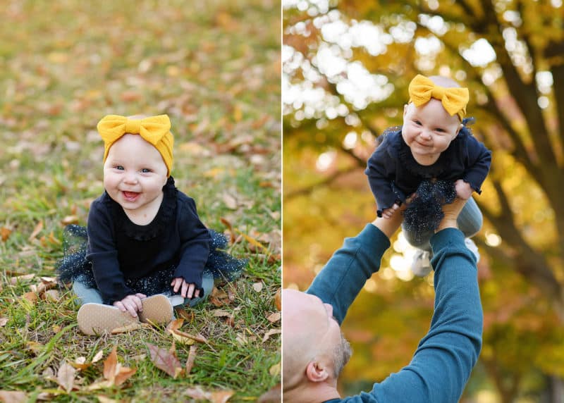 baby girl sitting on the grass in fall leaves, dad holding baby up in the air during family photos