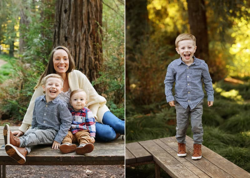 mom with two young boys sitting on a bench in the redwood forest, boy laughing at the camera