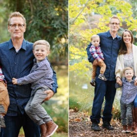 dad holding two young children on his hips, family of four posing in front of fall foliage