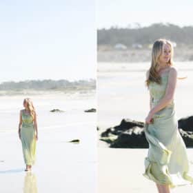 senior girl in college wearing a dress on the beach and walking in carmel california