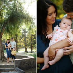 family of four standing under a tree, mom and dad holding baby girl in sacramento california