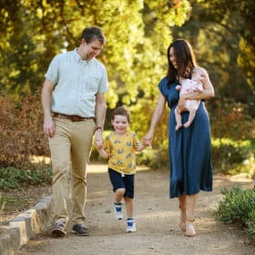 family of four walking together on a path in springtime in sacramento california